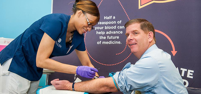 Boston Mayor, Martin Walsh giving blood to the Orig3n cell bank.